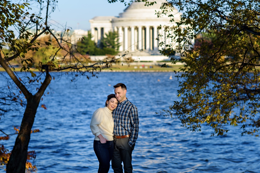 A DC couple soak up the sun along the tidal basin.